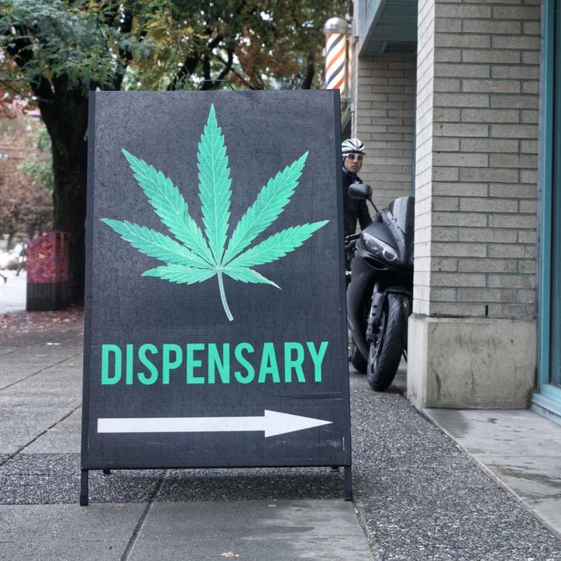 A Black sign "Cannabis dispensary" on Burrard Street  hangover cure idea