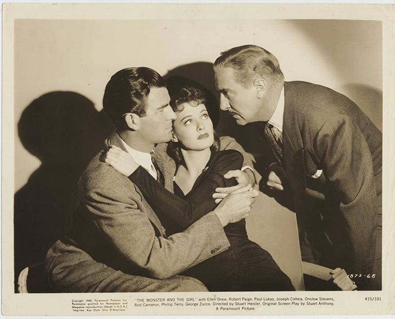 A production still of Rod Cameron, Ellen Drew and Paul Lukas in "The Monster and the Girl"