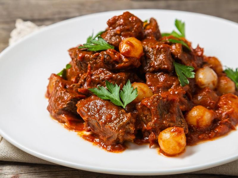 A traditional Greek dish of beef stifado in a sauce