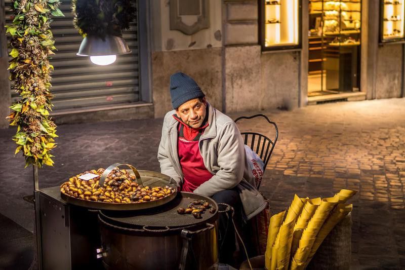 A traditional seller of roasted chestnuts near the Spanish Steps in downtown Rome