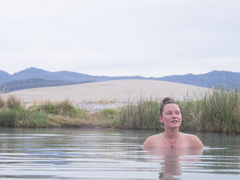 A woman enjoys a hot spring