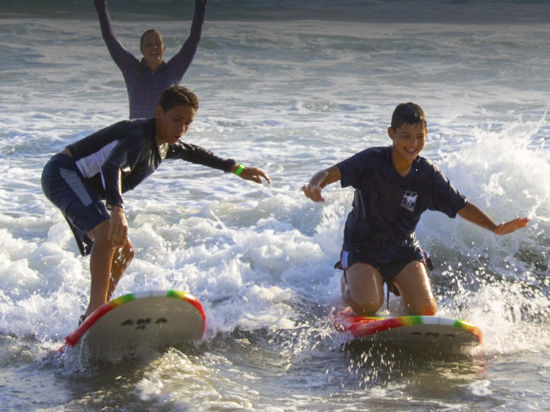 Academy by the Sea campers learning to surf