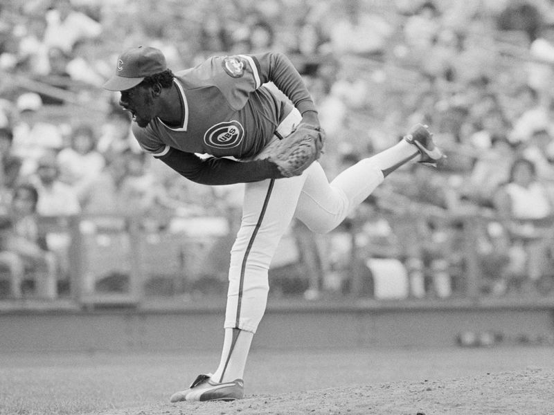 Ace Chicago Cubs relief pitcher Lee Smith following through