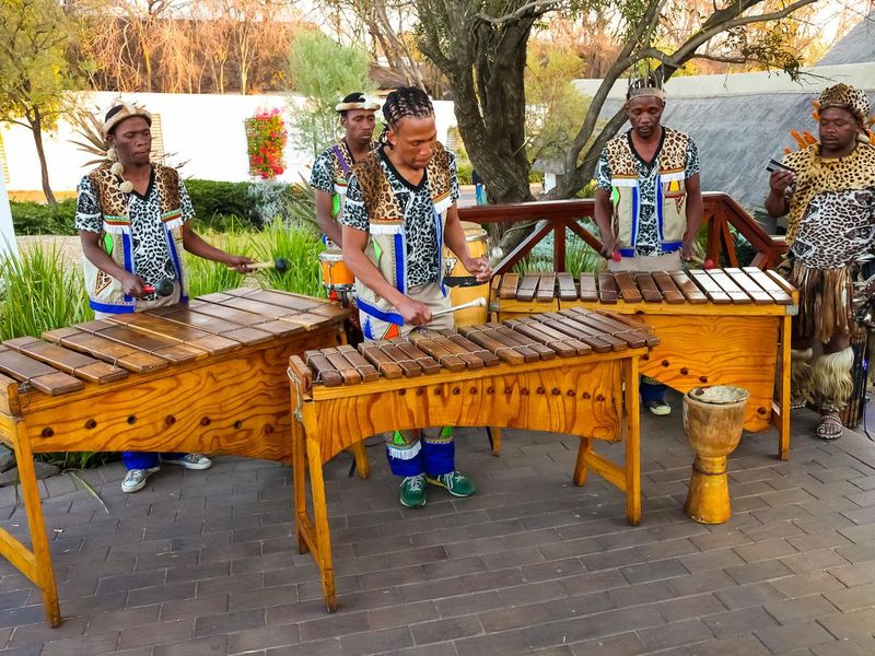 African Men playing traditional drums