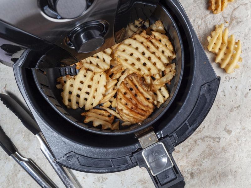 Air frying waffle potato fries at home