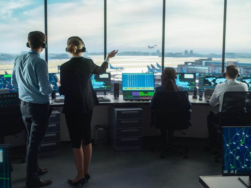Air traffic controllers with headsets