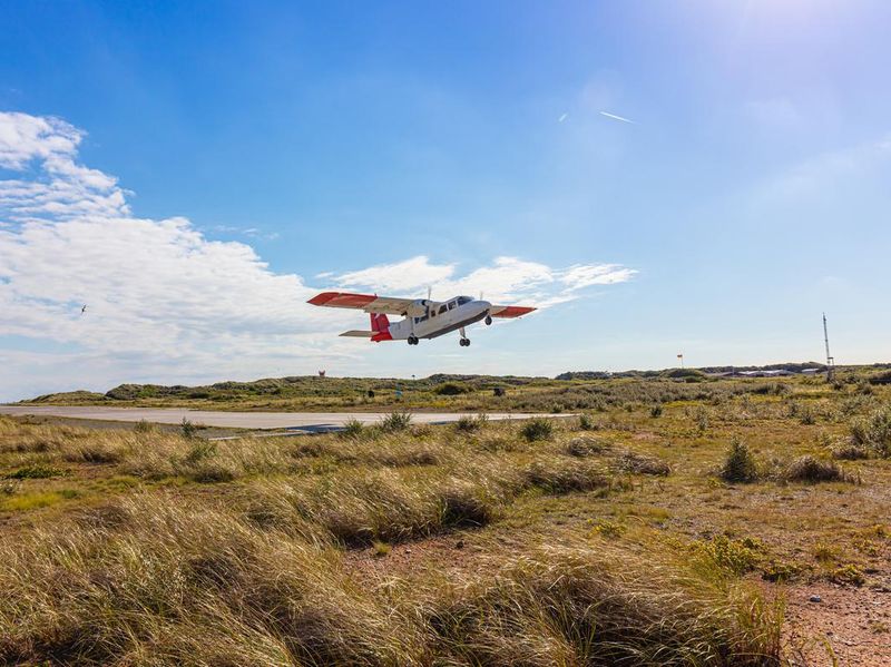 Airplane after take-off on the dune, island Helgoland, Schleswig