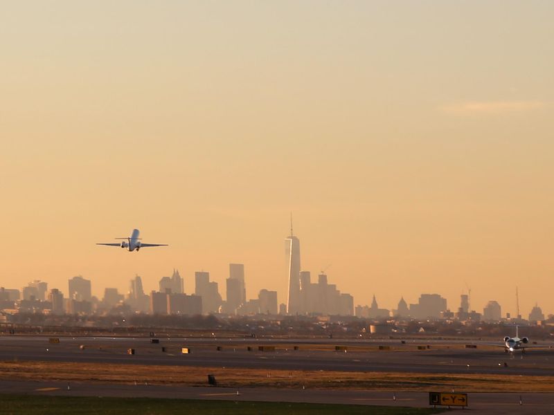 Airplane Take Off with New York City Skyline
