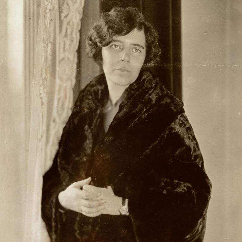Alice Paul showing off the Cocoon Fur Coat fashion trend