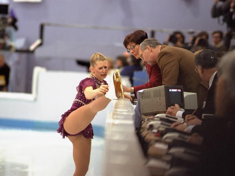 American figure skater Tonya Harding cries as she shows judges lace problem with skate