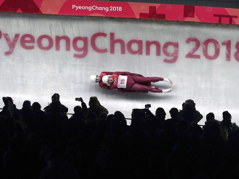 Andrei Bogdanov and Andrei Medvedev take a curve in 2018 Pyeongchang Olympic Games