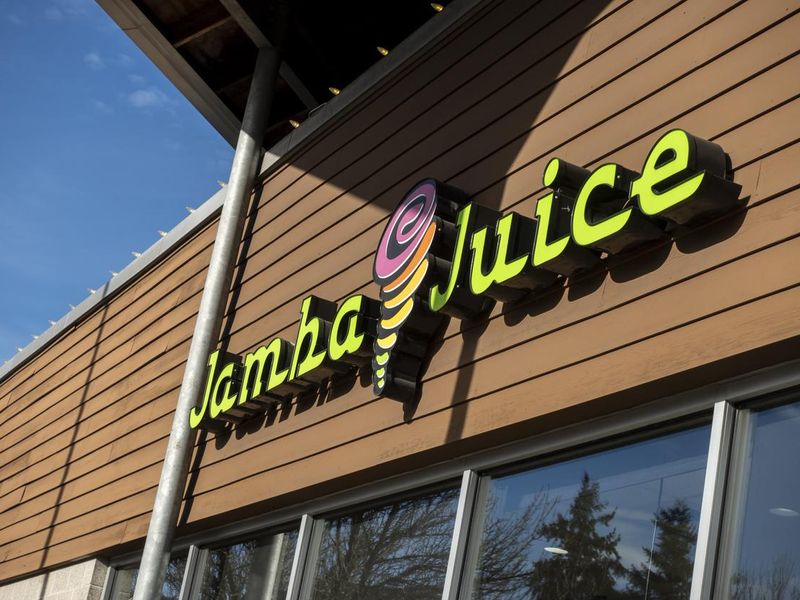 Angled view of the exterior of a Jamba Juice smoothie shop in the downtown area.