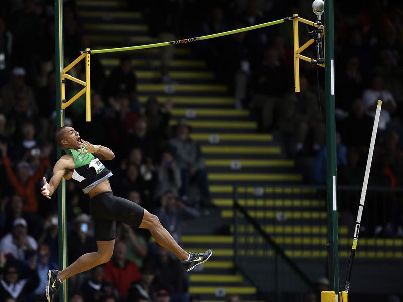 Ashton Eaton reacts after clearing bar