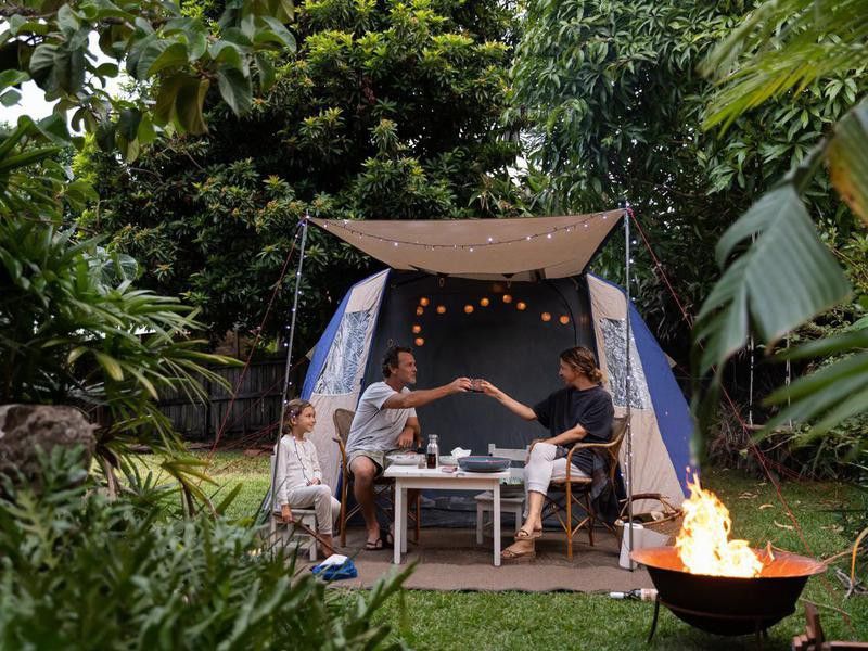Australian family camping in backyard