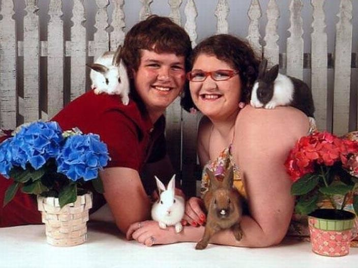 Awkward portrait of a couple with bunnies