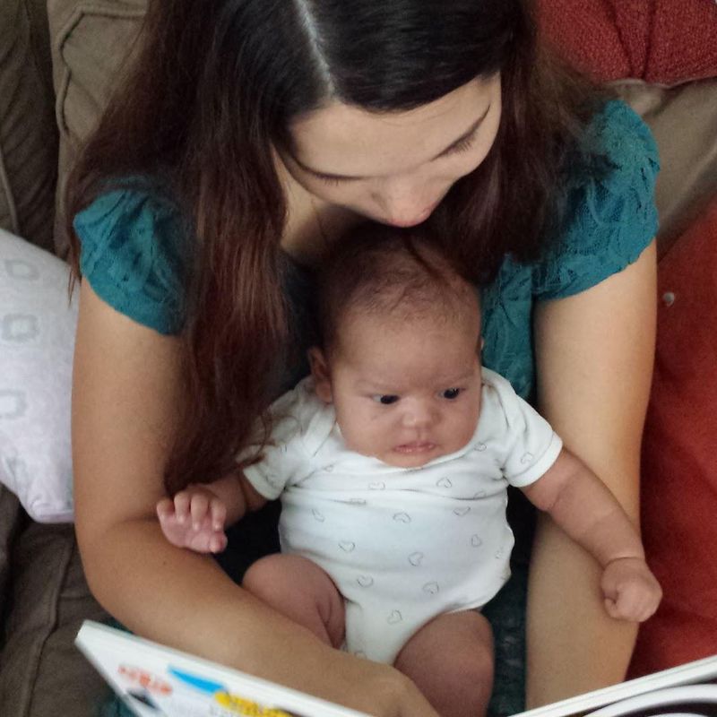 Baby looking at a book