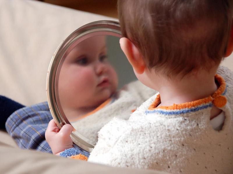 Baby looking at mirror