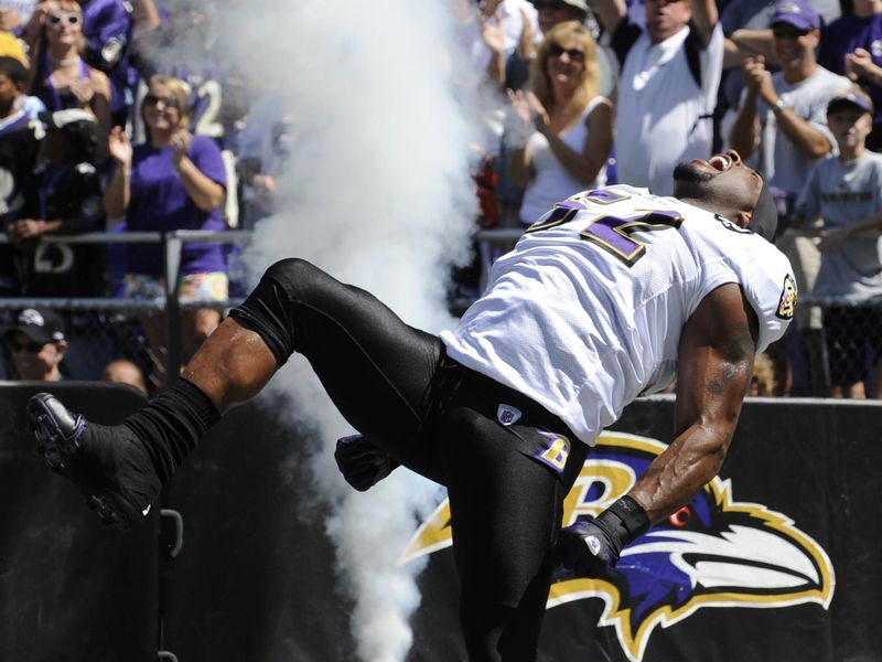 Baltimore Ravens linebacker Ray Lewis struts and yells