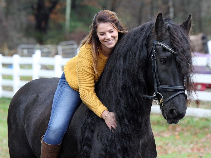 Bareback Rider and her Friesan Horse