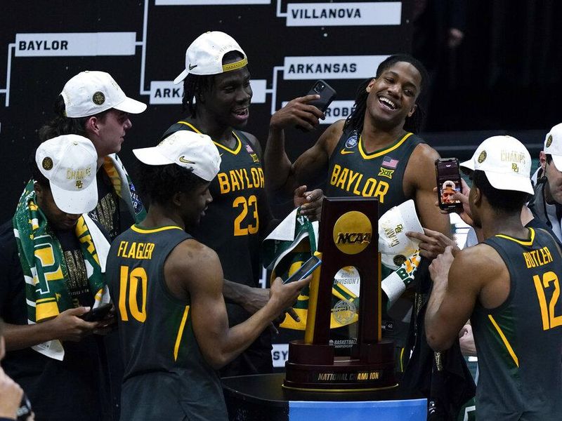 Baylor players celebrate with the national championship trophy in 2021