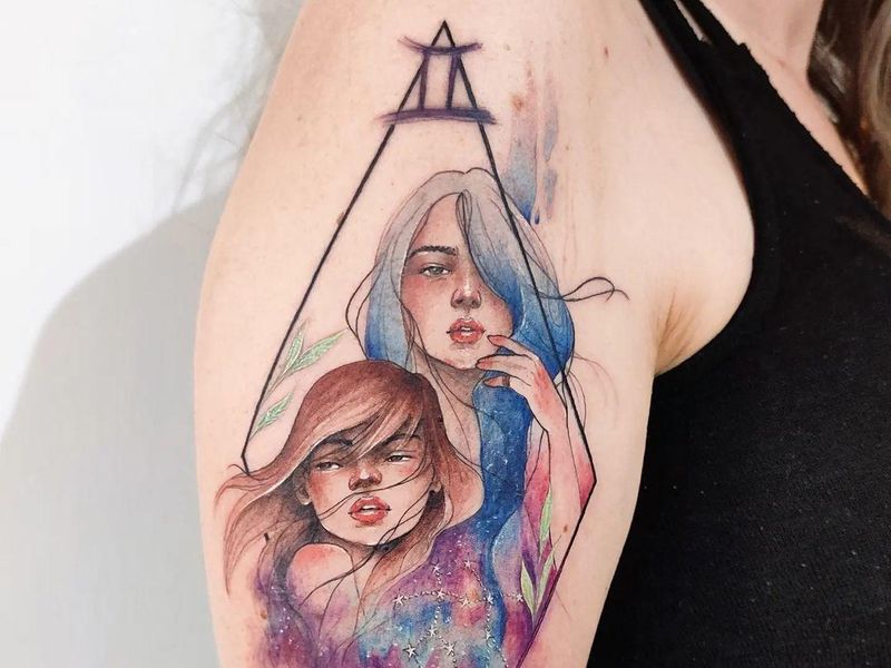 Beautiful watercolor Gemini tattoo
