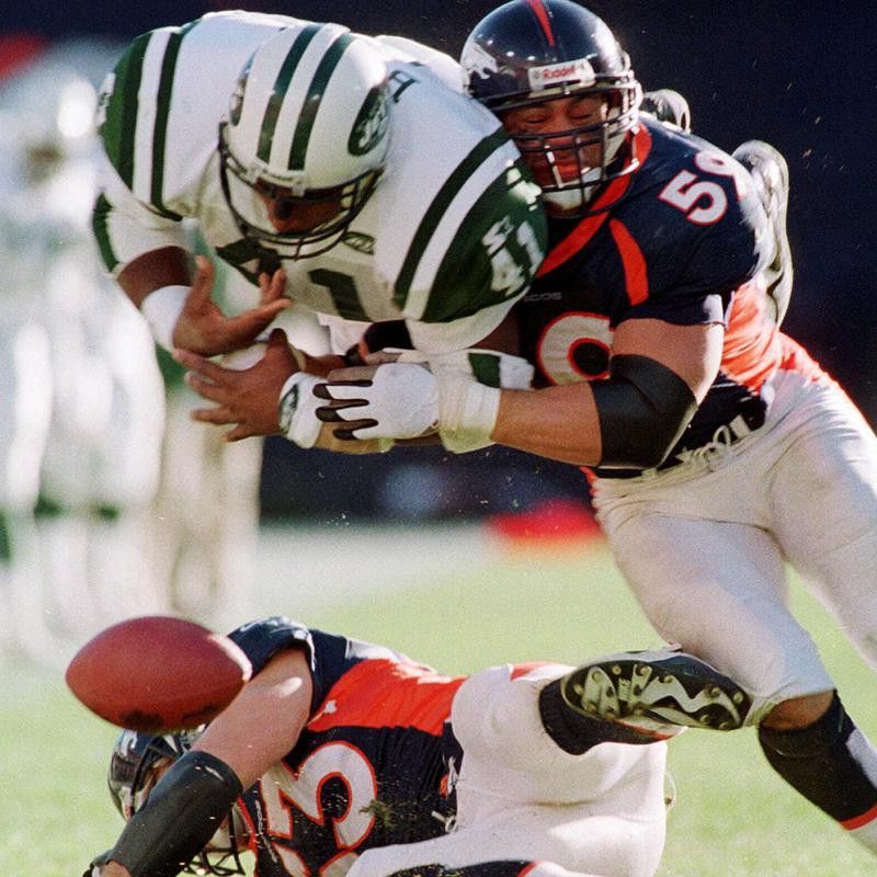 Bill Romanowski forces Keith Bryars of the New York Jets to fumble the ball