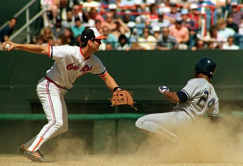 Billy Ripken forces out Rickey Henderson of the New York Yankees in Baltimore