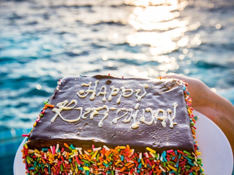 Birthday cake by the ocean in the Maldives