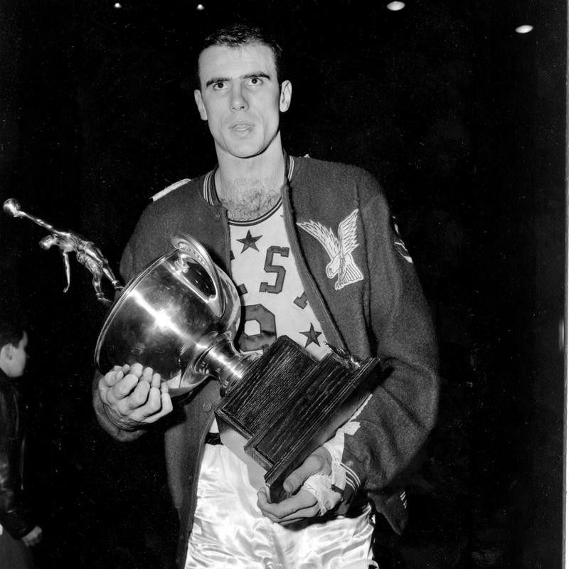 Bob Pettit holds up MVP trophy