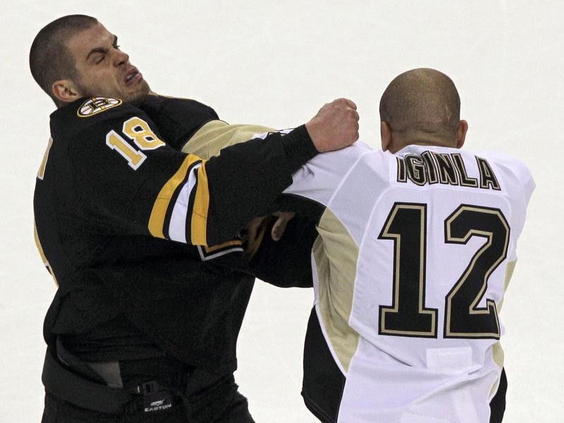 Boston Bruin Nathan Horton and Pittsburgh Penguin Jarome Iginla exchange punches