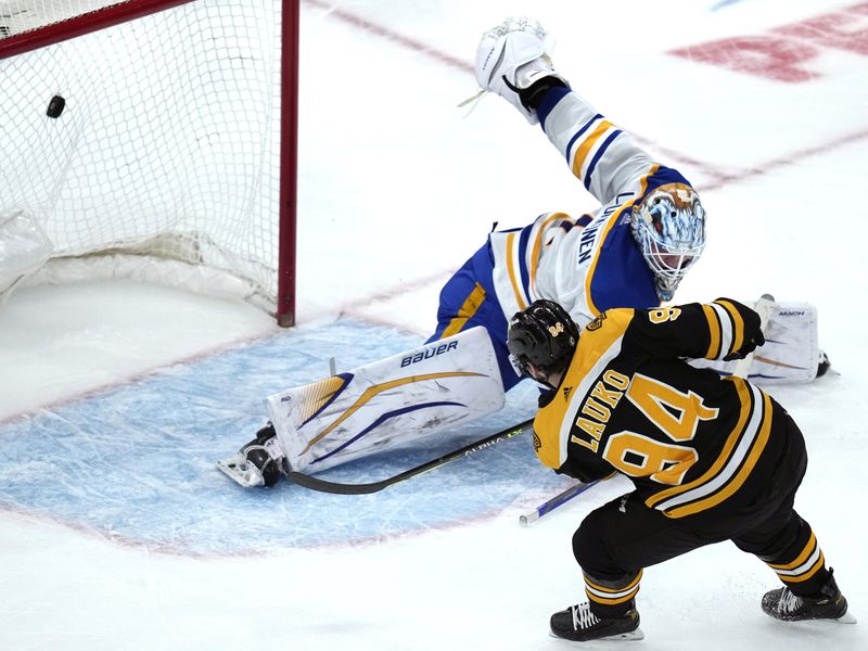 Boston Bruins forward Jakub Lauko scores against Buffalo Sabres goaltender Ukko-Pekka Luukkonen