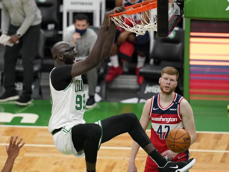 Boston Celtics center Tacko Fall dunks against Washington Wizards' Davis Bertans