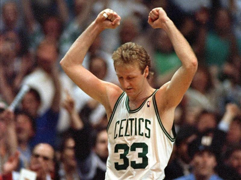 Boston Celtics' Larry Bird raises arms in victory