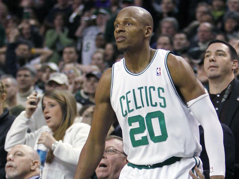 Boston Celtics' Ray Allen watches in front of the Los Angeles Lakers bench
