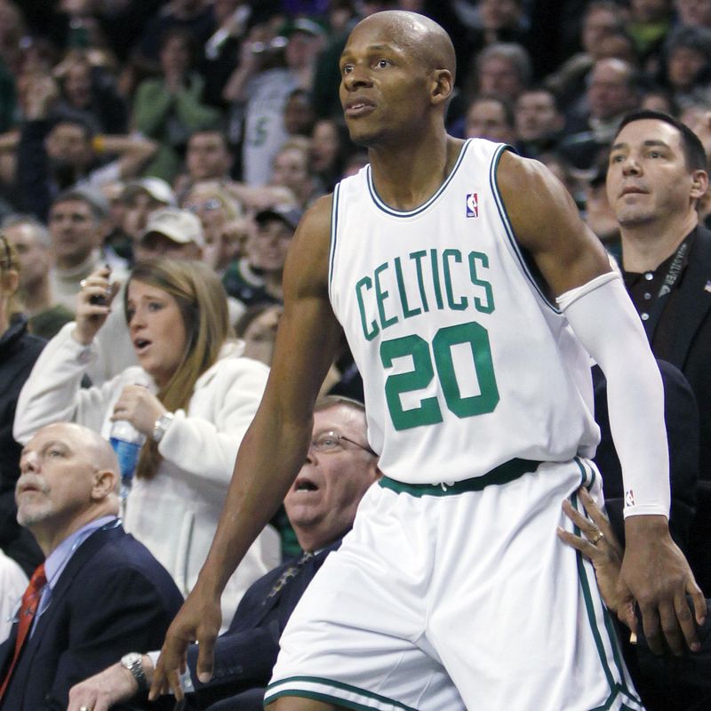 Boston Celtics' Ray Allen watches in front of the Los Angeles Lakers bench