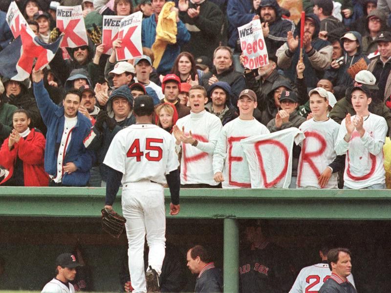 Boston Red Sox pitcher Pedro Martinez is cheered by fans