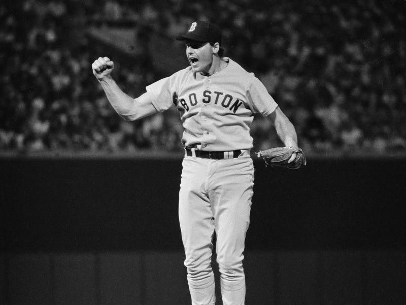 Boston Red Sox pitcher Roger Clemens throws fist in air celebrating