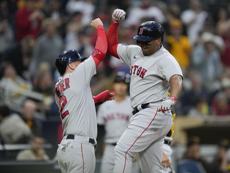 Boston Red Sox third baseman Rafael Devers celebrates with Justin Turner after hitting a home run