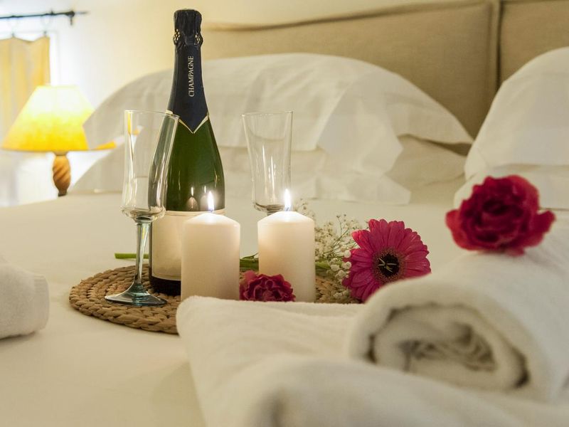 bottle of champagne in bed