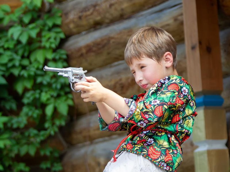 boy with toy gun