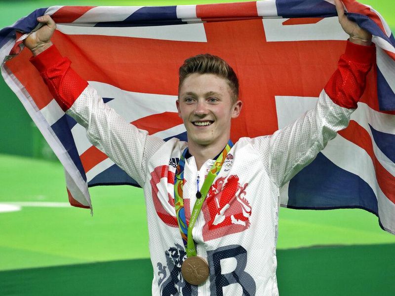 Britain's Nile Wilson celebrates his bronze medal