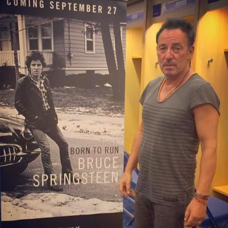 Bruce Springsteen with "Born to Run" poster at MetLife Stadium in New Jersey