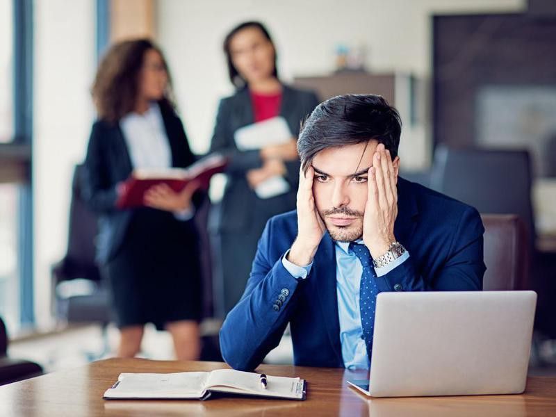Burnout businessman under pressure in the office