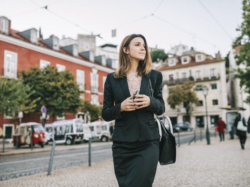Businesswoman walking in Lisbon