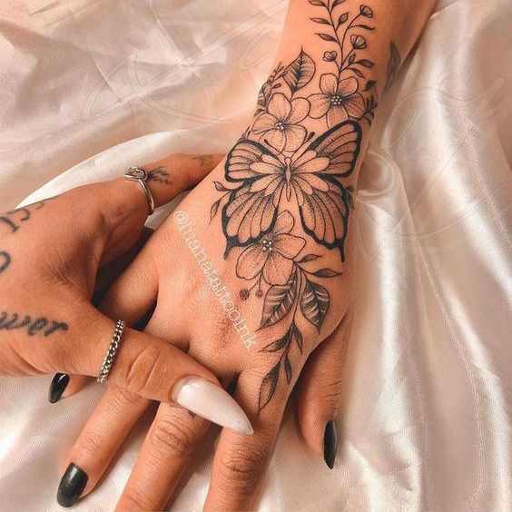 Floral Butterfly tattoo on hand for girl
