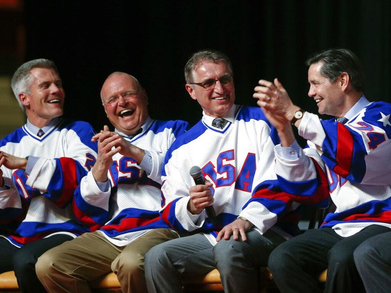 Buzz Schneider celebrates with old Miracle on Ice teammates