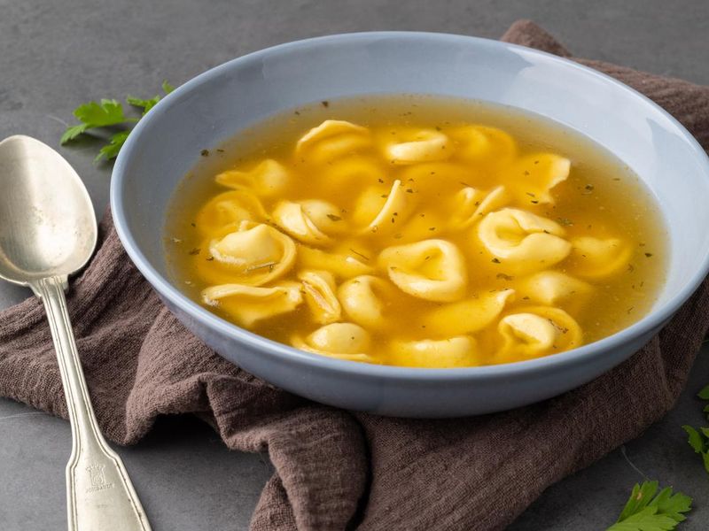 Cappelletti or tortellini brodo soup in a bowl