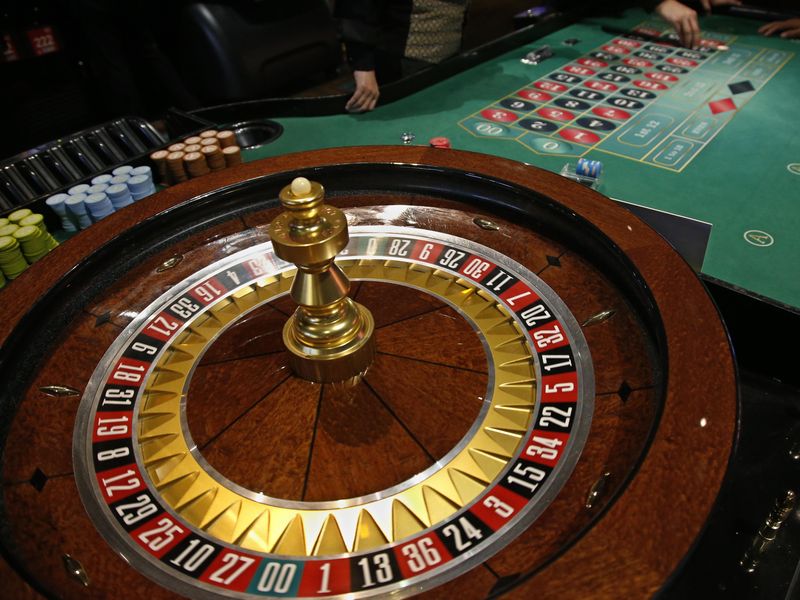 Casino players at a roulette wheel