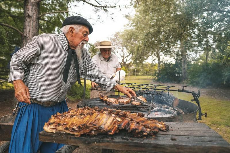 Chef preparing pork ribs in Argentina