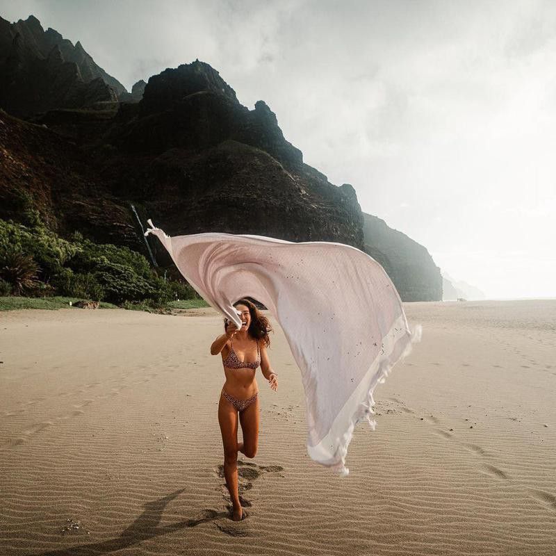 Chelsea Yamase running on beach in Hawaii